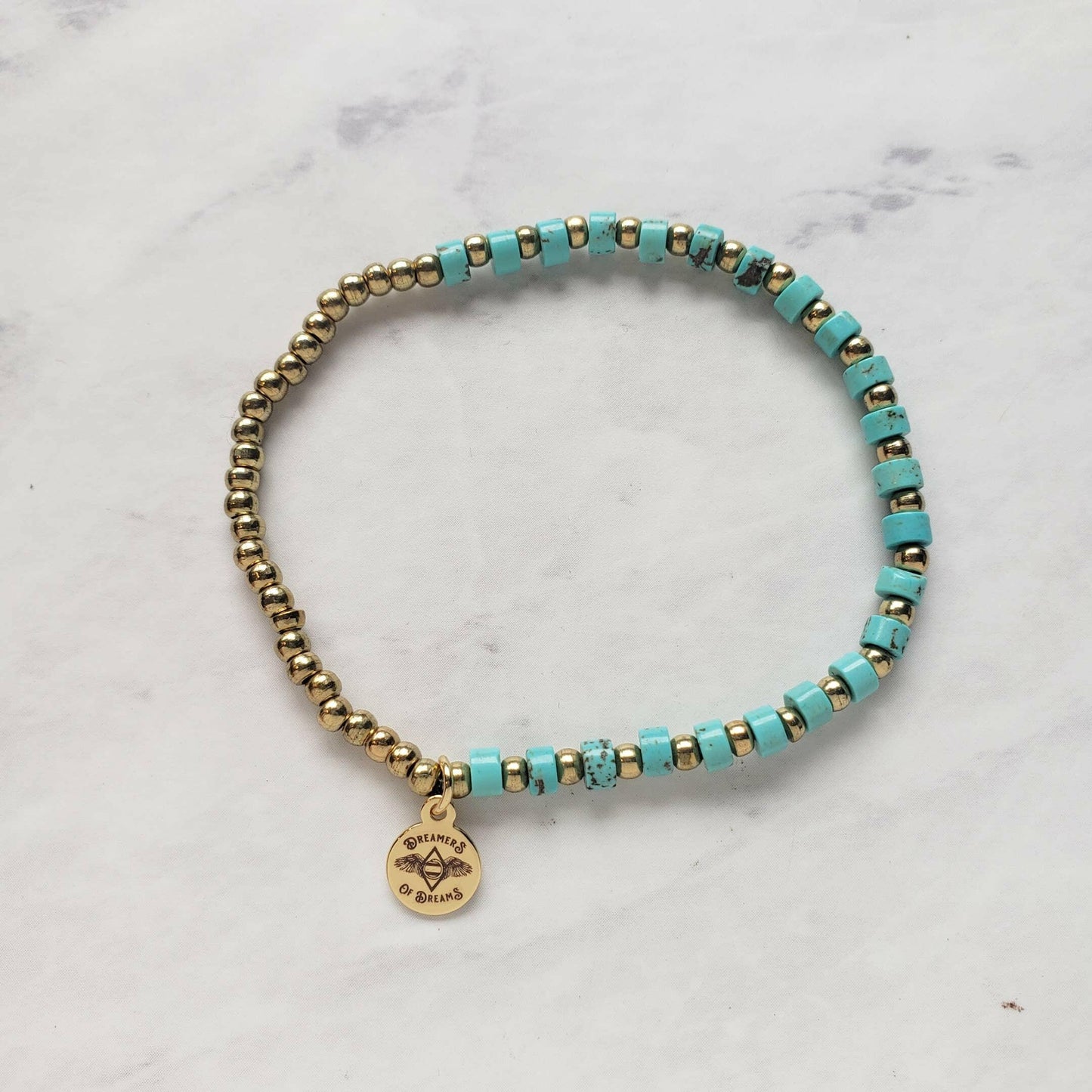 Dreamers of Dreams Mini Turquoise Heishi Beaded Bracelet with Brass Accent Beads Stretchy 7 Inch Length - Pink Pig