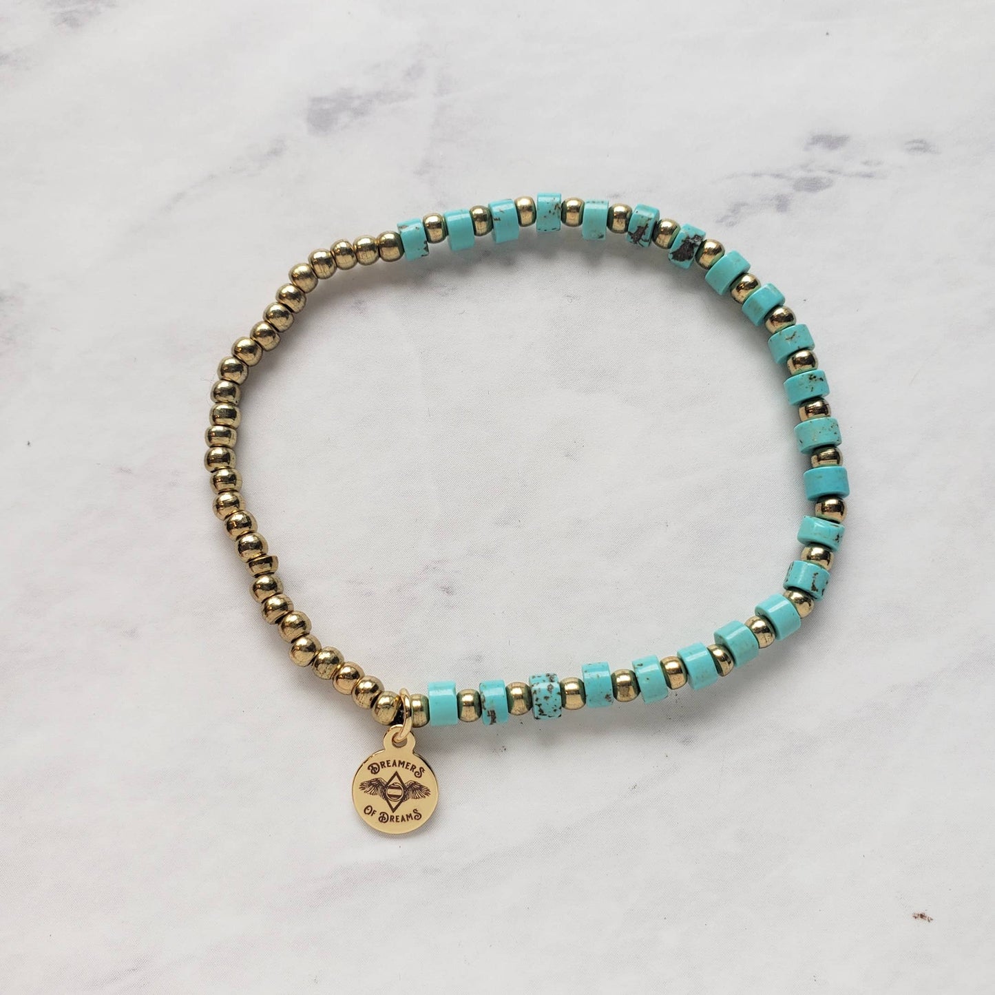 Dreamers of Dreams Mini Turquoise Heishi Beaded Bracelet with Brass Accent Beads Stretchy 7 Inch Length - Pink Pig